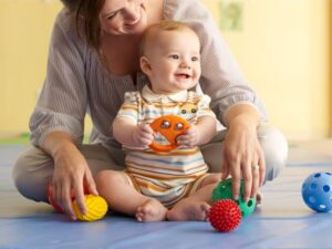 infant playing with mom1