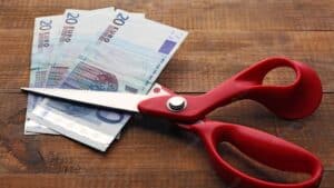 scissors cuts euro banknote wooden background 392895 110365 e1658239800707