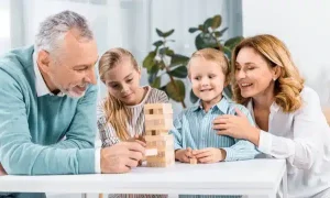 depositphotos 225737992 stock photo smiling grandparents grandchildren playing blocks e1715691868679