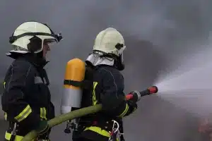 firefighters using water fog type