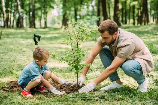 depositphotos 197149682 stock photo side view father son planting