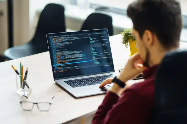 depositphotos 573595830 stock photo young man works computer office